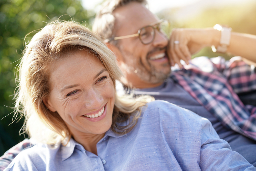 Portrait,Of,Mature,Couple,Relaxing,In,Outdoor,Sofa